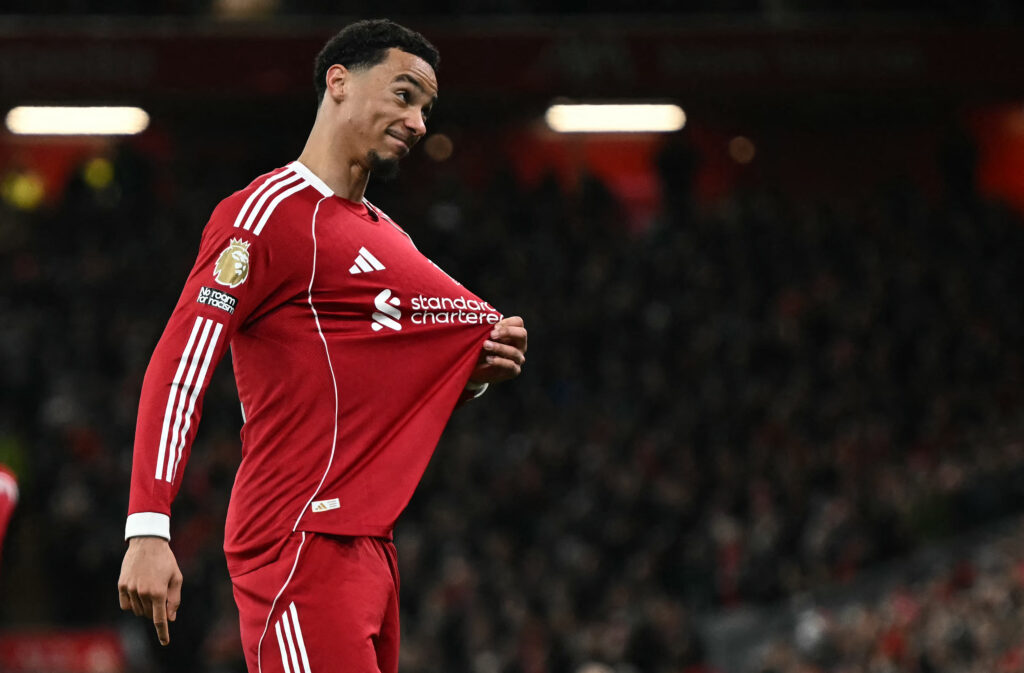 Hugo Ekitike points to the Liverpool badge after scoring against Brighton in the Premier League at Anfield.