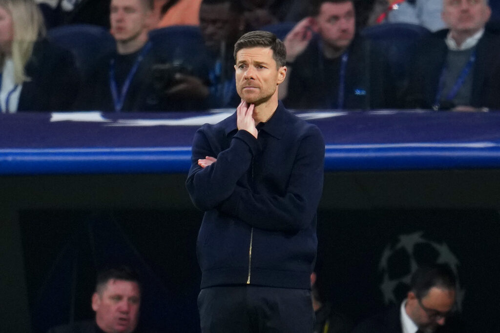 Xabi Alonso looks worried on the touchline during Real Madrid's UEFA Champions League match against Manchester City at the Bernabeu.