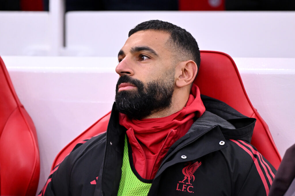 Mohamed Salah of Liverpool sits on the bench during the Premier League match between Liverpool and Brighton & Hove Albion at Anfield