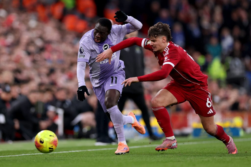 Milos Kerkez and Yankuba Minteh battle for the ball during Liverpool's Premier League match against Brighton at Anfield.