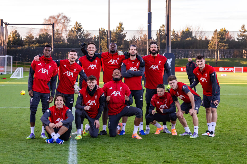Liverpool players pose in formation after a training session at the AXA Training Centre.