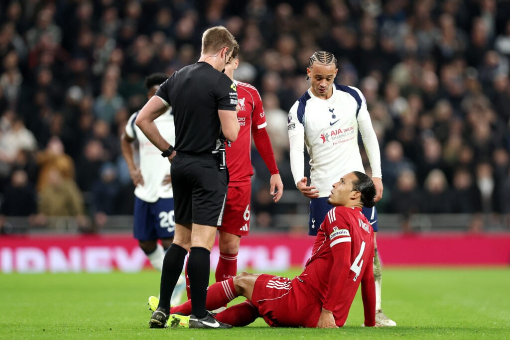 Virgil van Dijk of Liverpool interacts with Referee John Brooks after being fouled by Xavi Simons of Tottenham Hotspur during the Premier League match between Tottenham Hotspur and Liverpool at Tottenham Hotspur Stadium