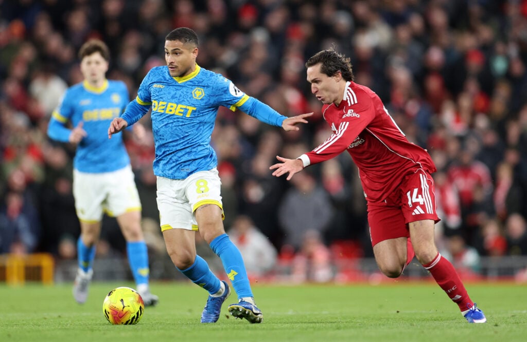 Federico Chiesa challenges Joao Gomes during Liverpool's Premier League match against Wolverhampton Wanderers at Anfield.