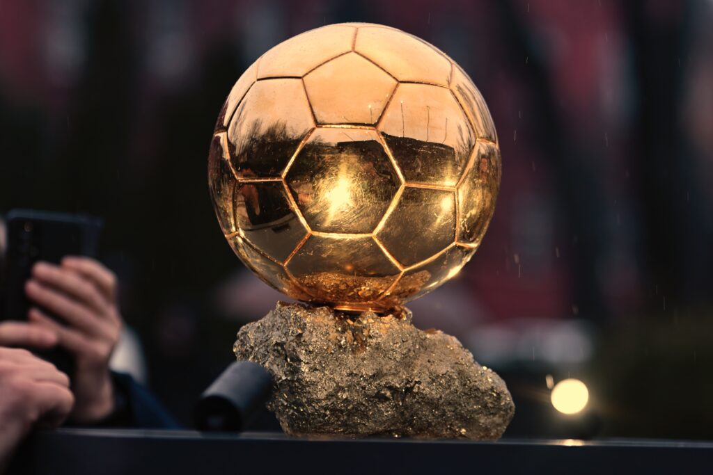 People take photos of the Ballon d’Or received by Andriy Shevchenko exhibited in the Taras Shevchenko Park