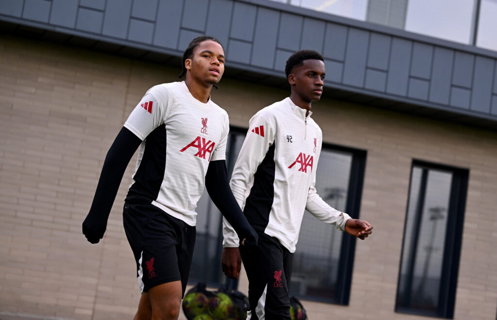 Rio Ngumoha and Trey Nyoni walk out ahead of a training session for Liverpool