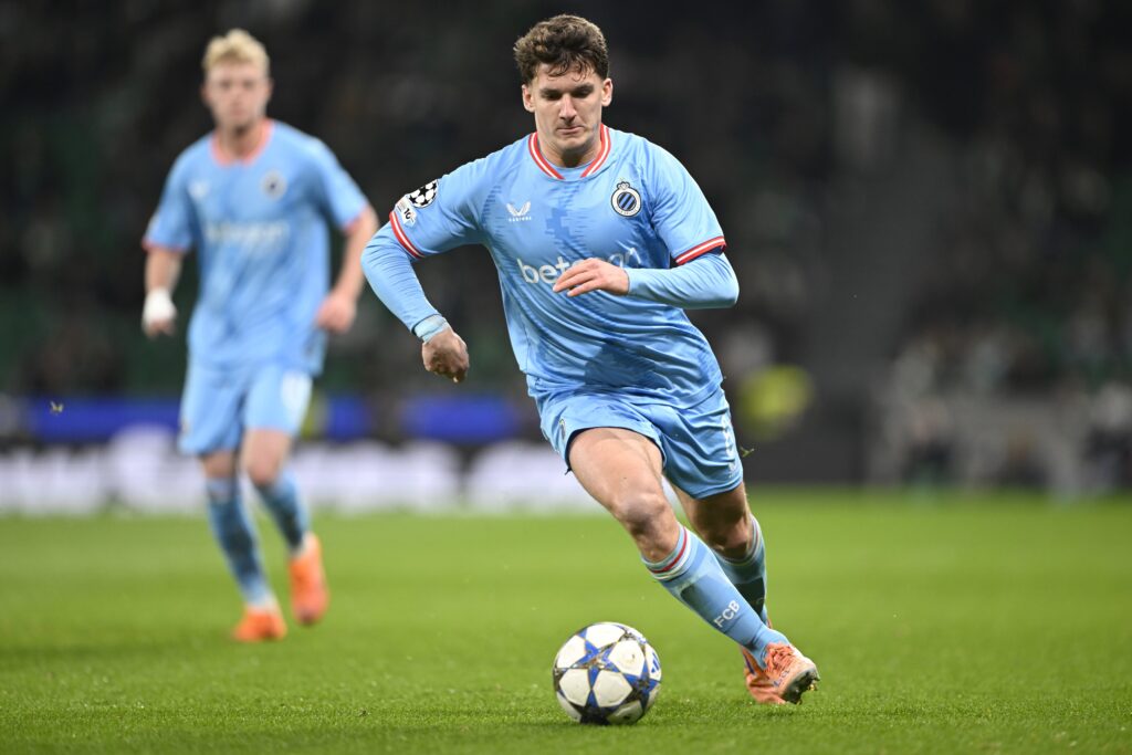 Christos Tzolis runs with the ball during Club Brugge's UEFA Champions League match against Sporting at Jose Alvalade Stadium