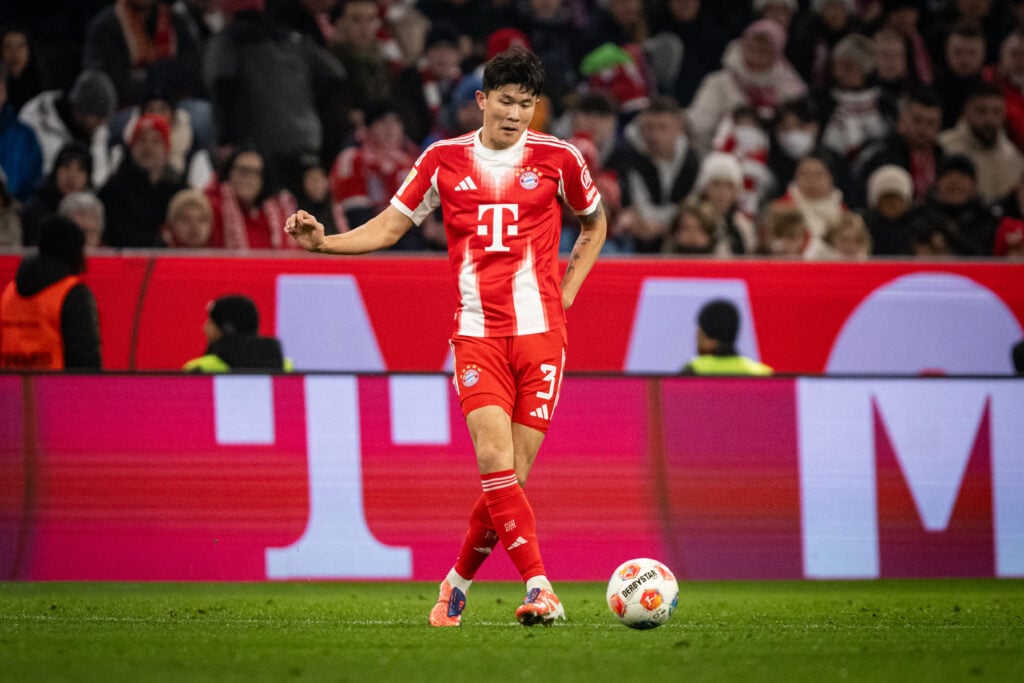 Bayern Munich centre-back Kim Min-Jae passes the ball during a Bundesliga match against Mainz at the Allianz Arena.