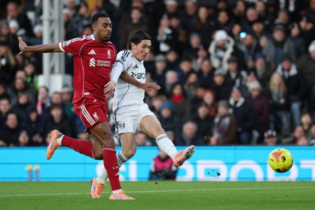 Fulham's Welsh midfielder #08 Harry Wilson (R) scores the opening goal to take the lead 1-0 during the English Premier League football match between Fulham and Liverpool at Craven Cottage