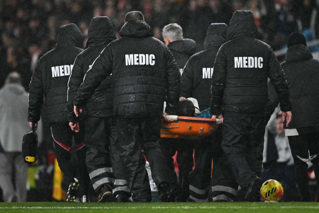 Conor Bradley is removed from the pitch on a stretcher during Liverpool's Premier League match against Arsenal at the Emirates Stadium