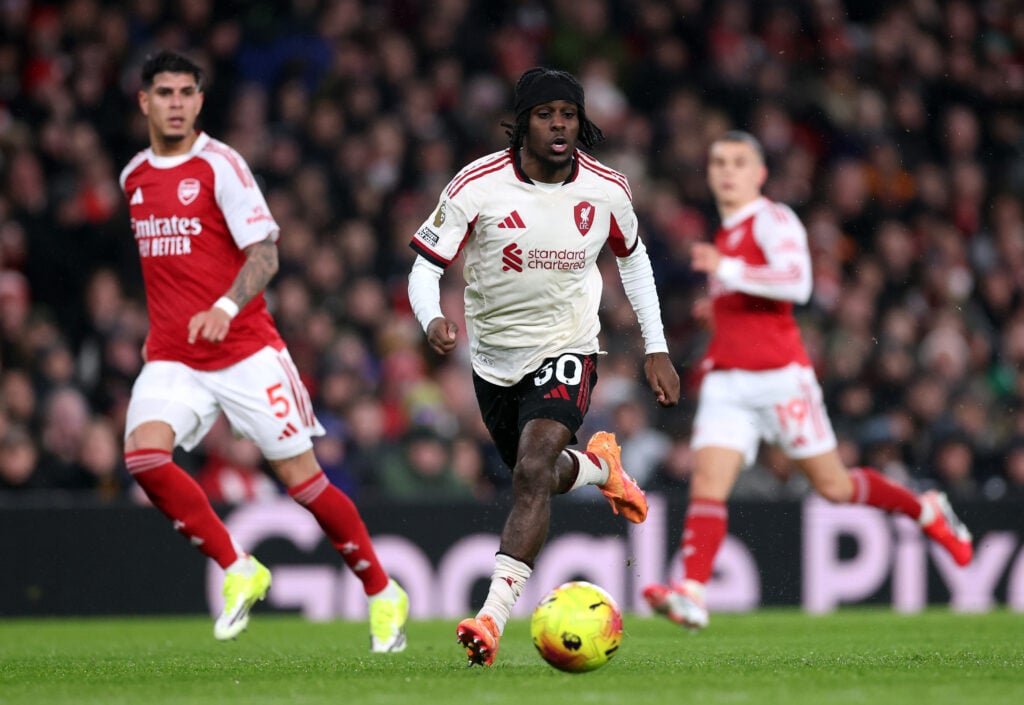 Jeremie Frimpong runs with the ball during Liverpool's Premier League match against Arsenal at the Emirates Stadium.