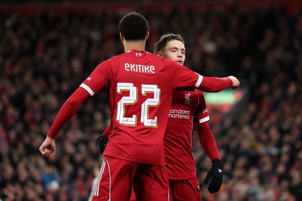 Florian Wirtz and Hugo Ekitike celebrate after Wirtz scores in the FA Cup against Barnsley at Anfield.