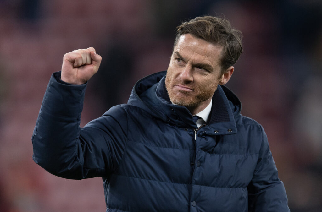 Scott Parker clenches his fist towards the Burnley fans after their Premier League match against Liverpool at Anfield