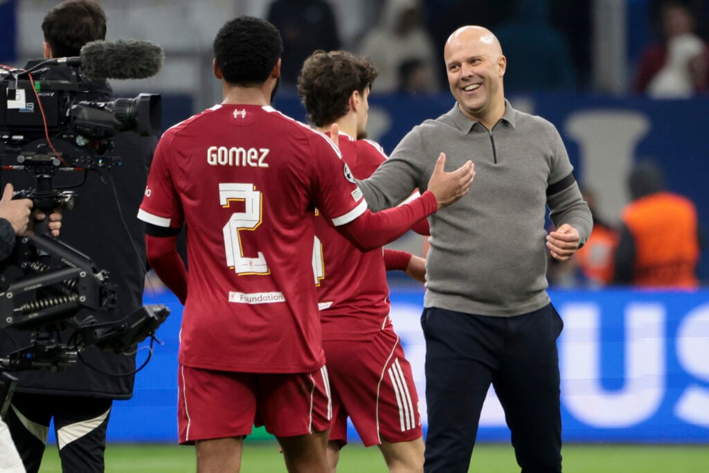 Arne Slot greets Joe Gomez after Liverpool's UEFA Champions League win against Marseille at Stade Velodrome