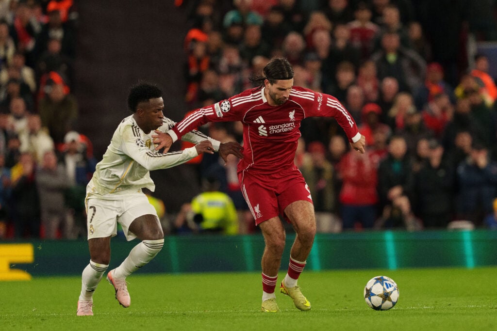 Vinicius Junior challenges Dominik Szoboszlai for the ball during Liverpool vs Real Madrid in the UEFA Champions League at Anfield