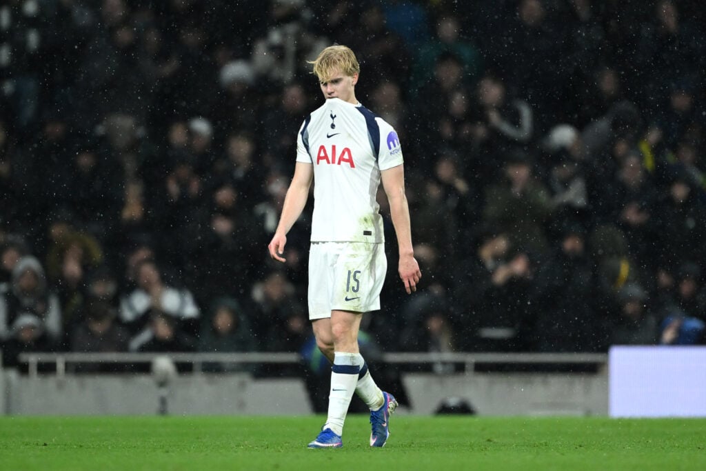 Lucas Bergvall chews his shirt as he walks from the pitch after being injured during Tottenham Hotspur's UEFA Champions League match against Borussia Dortmund