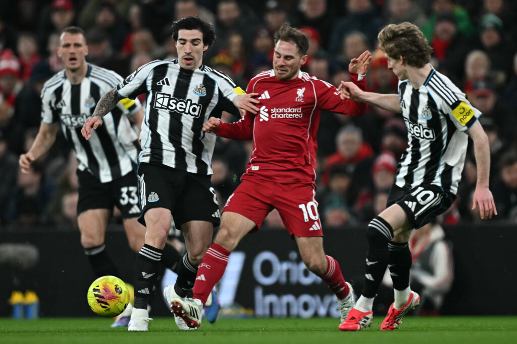 Sandro Tonali and Alexis Mac Allister battle for the ball during Liverpool vs Newcastle United in the Premier League at Anfield.
