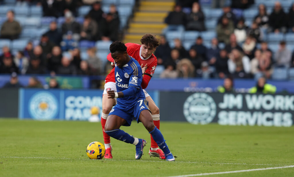 Luke Chambers battles Abdul Fatawu for the ball during Charlton Athletic's Championship match against Leicester City at the King Power Stadium