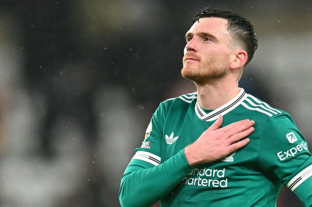 Andy Robertson taps the Liverpool badge as he thanks supporters after the Premier League match against Sunderland at the Stadium of Light.