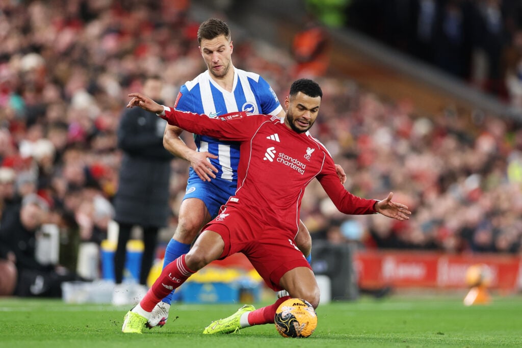 Cody Gakpo is challenged by Joel Veltman during the Emirates FA Cup Fourth Round match between Liverpool and Brighton
