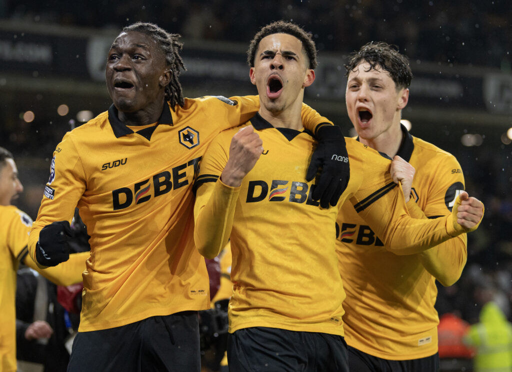 Wolves players celebrate with Tom Edozie after their eqaulising goal against Arsenal in the Premier League match at Molineux
