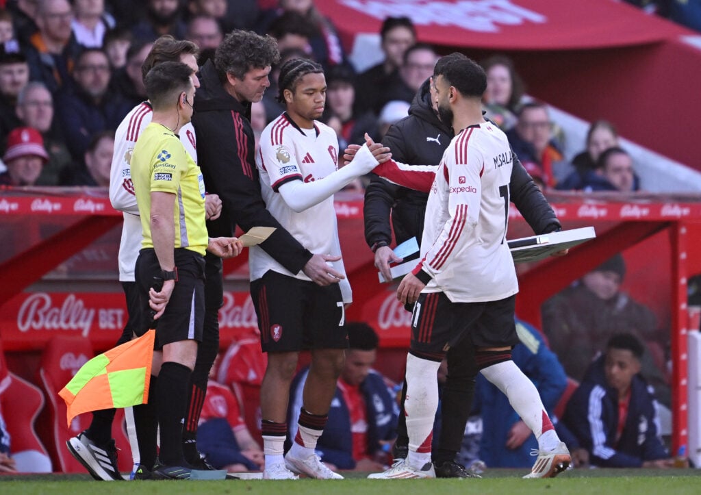 Rio Ngumoha shakes hands with Mohamed Salah as he comes on as a substitute during the Premier League match between Nottingham Forest and Liverpool