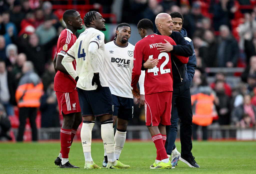 Arne Slot hugs Trey Nyoni after Liverpool beat West Ham United in the Premier League at Anfield.
