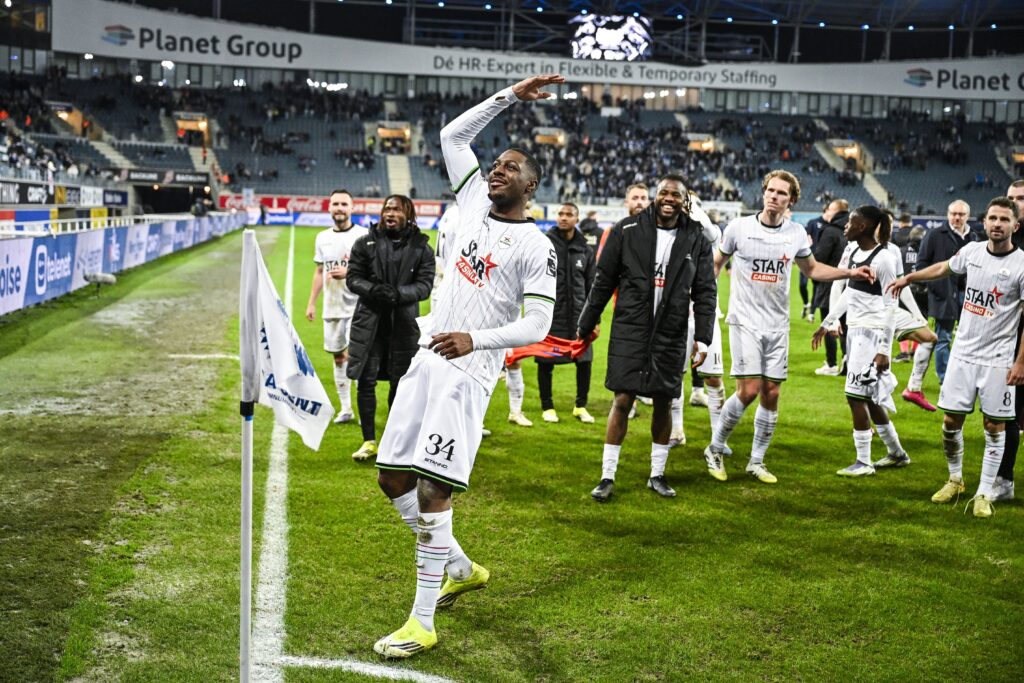 Roggerio Nyakossi celebrates with OH Leuven supporters after their Belgian Pro League win over KAA Gent
