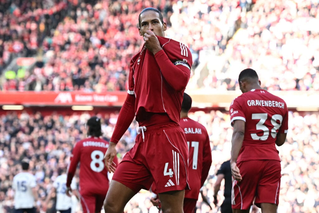 Virgil van Dijk kisses the Liverpool badge in front of the Kop after scoring in the Premier League match against West Ham United at Anfield.