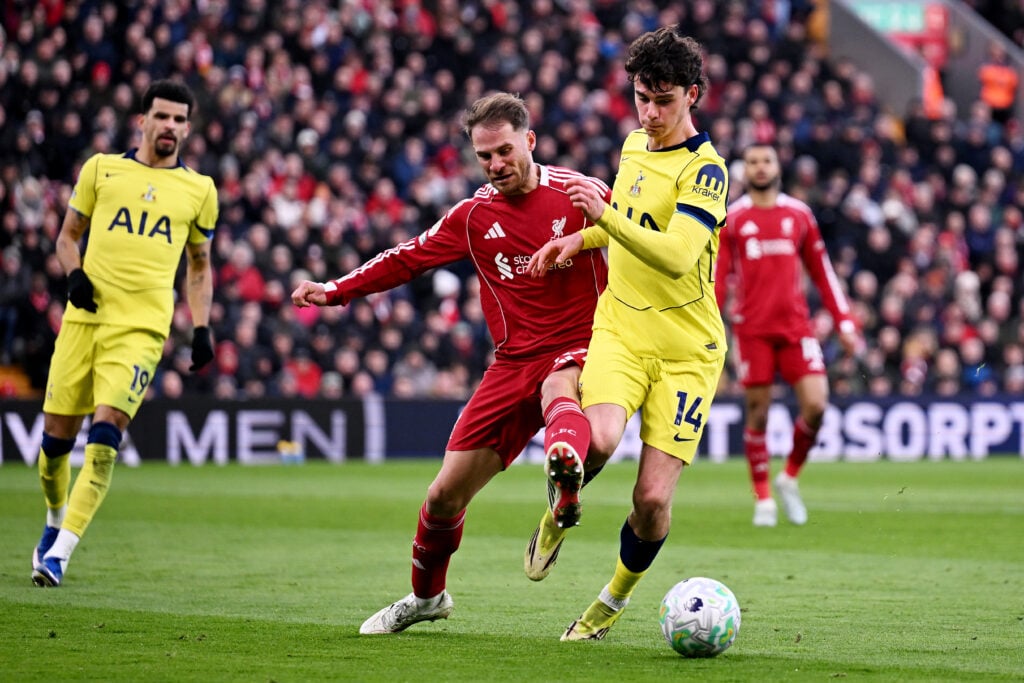 Alexis Mac Allister battles with Archie Gray for the ball during Liverpool's Premier League match against Tottenham Hotspur at Anfield