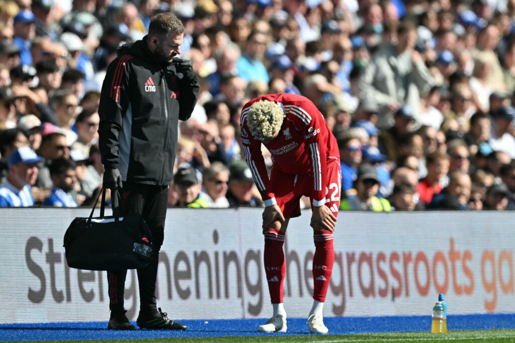 Hugo Ekitike puts his hands on his knees after coming off injured during Liverpool's Premier League match against Brighton & Hove Albion at the Amex Stadium