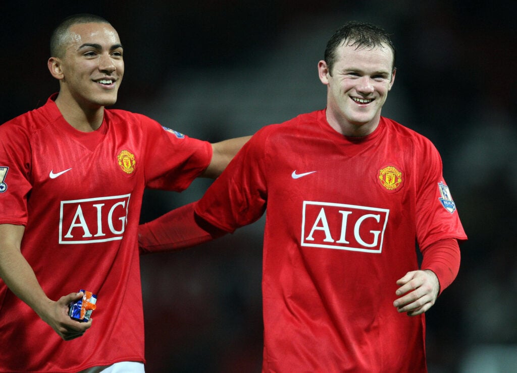 Wayne Rooney (R) and Danny Simpson of Man United