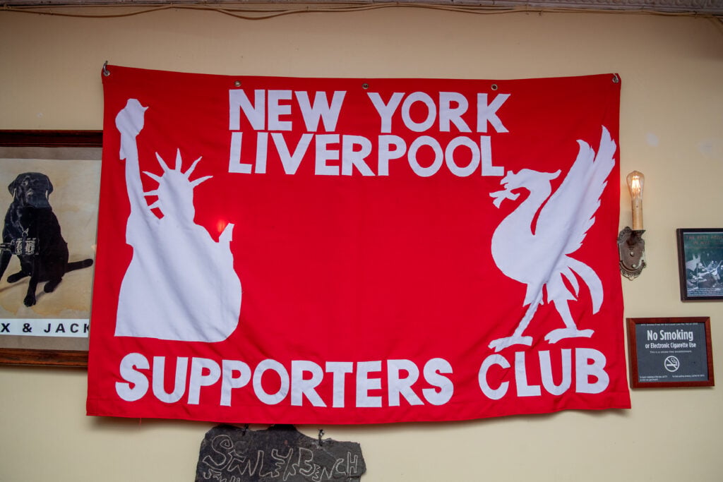 A banner displaying message from Liverpool Supporters' Club in New York