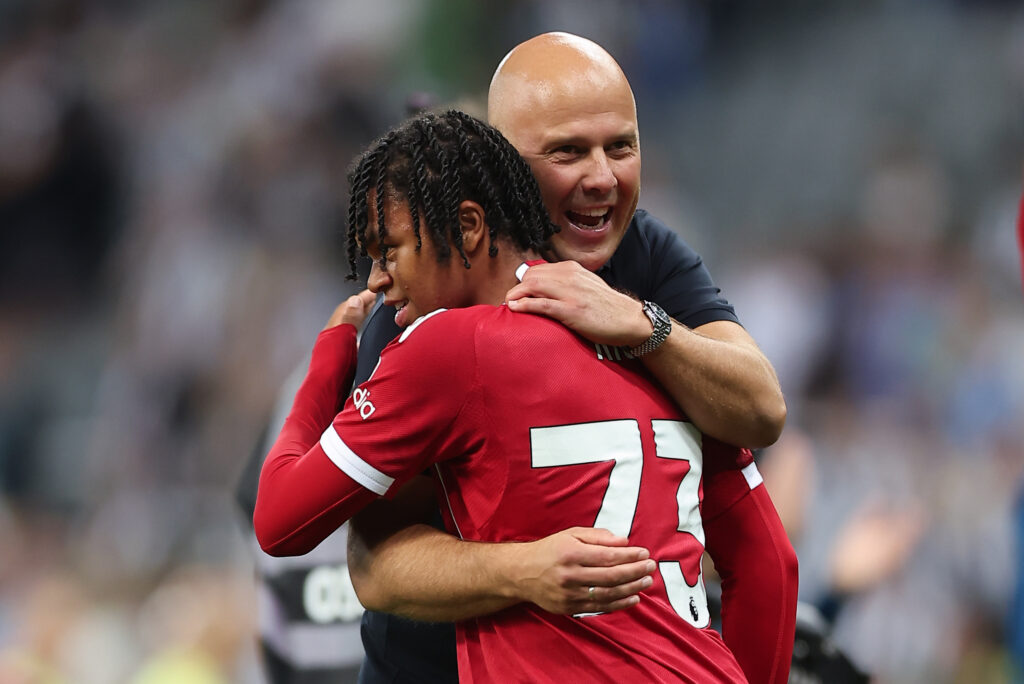 Rio Ngumoha of Liverpool is hugged by Liverpool manager Arne Slot after he had scored the late winning goal during the Premier League match between Newcastle United and Liverpool at St James' Park