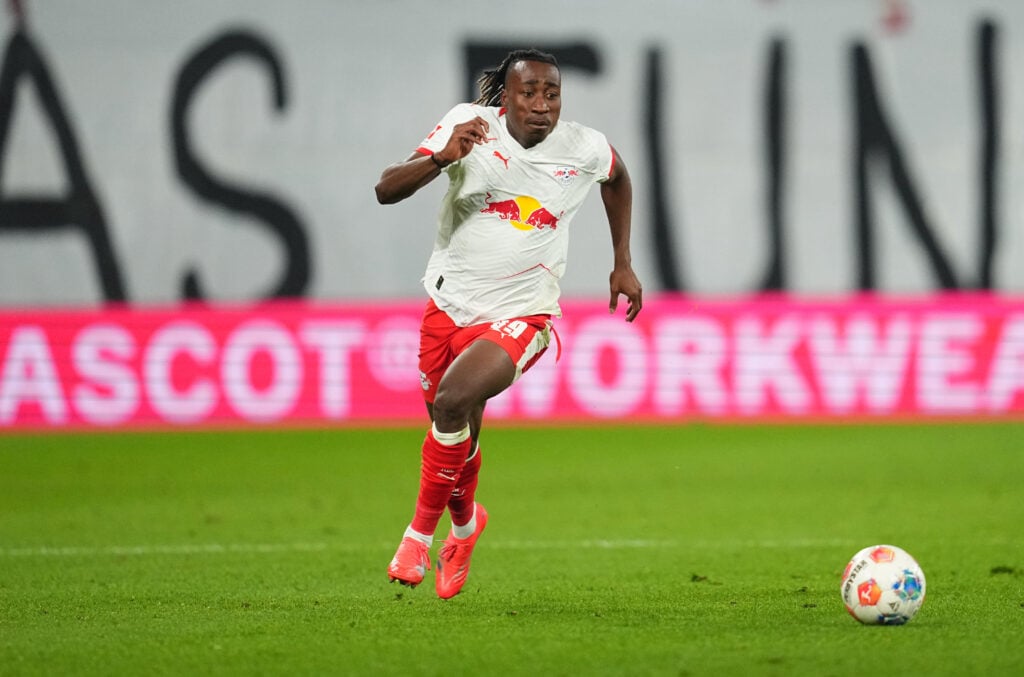 Yan Diomande pictured running with the ball during RB Leipzig's Bundesliga match against Hoffenheim at Red Bull Arena