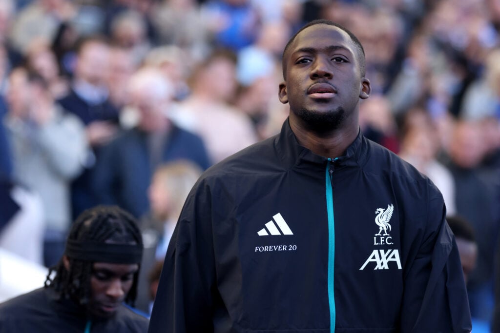 Ibrahima Konate walks out ahead of Liverpool's Premier League match against Brighton & Hove Albion at the Amex Stadium.