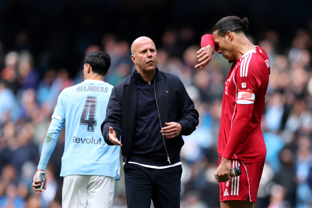 Virgil van Dijk greets Arne Slot after Liverpool's FA Cup match against Manchester City at the Etihad Stadium