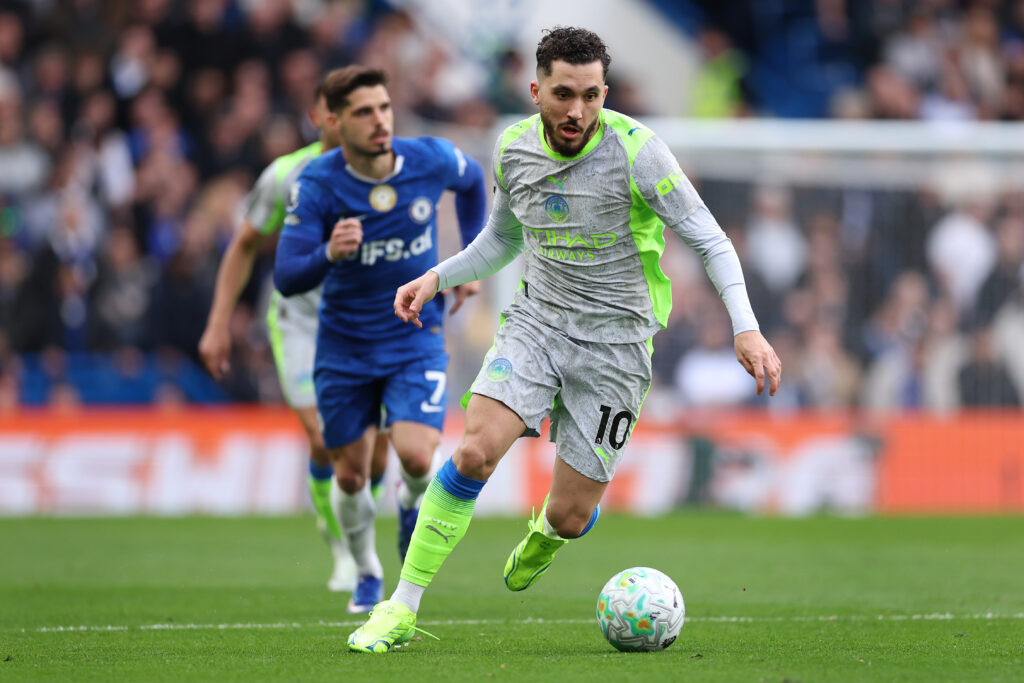 Rayan Cherki runs with the ball during Manchester City's Premier League match against Chelsea at Stamford Bridge.
