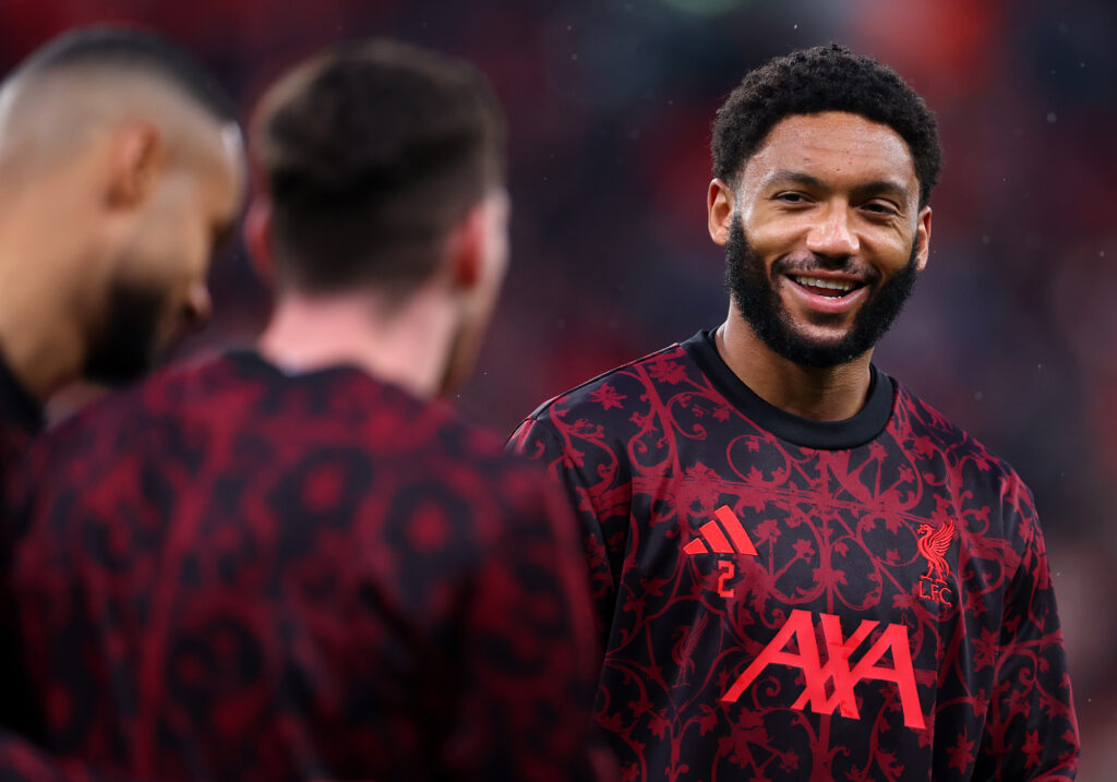 Joe Gomez laughs as he warms up ahead of Liverpool's UEFA Champions League quarter-final match against Paris Saint-Germain at Anfield.