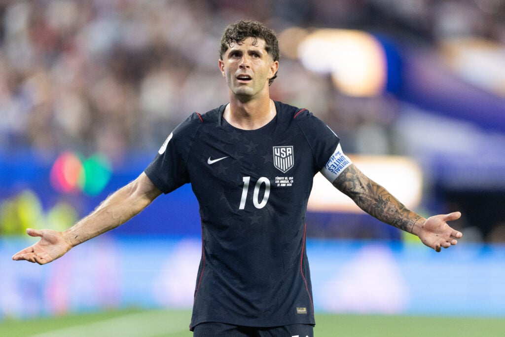 Christian Pulisic spreads his arms during the USA's FIFA World Cup group stage match against Turkey in Inglewood