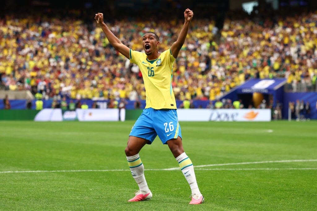 Rayan Vitor celebrates Casemiro scoring during Brazil's FIFA World Cup last-32 match against Japan in Houston